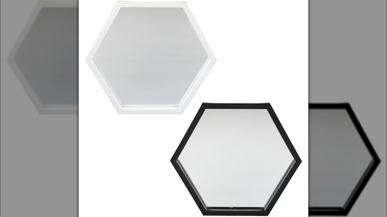 Hexagon-shaped mirrors, one with a white frame and one with a black frame