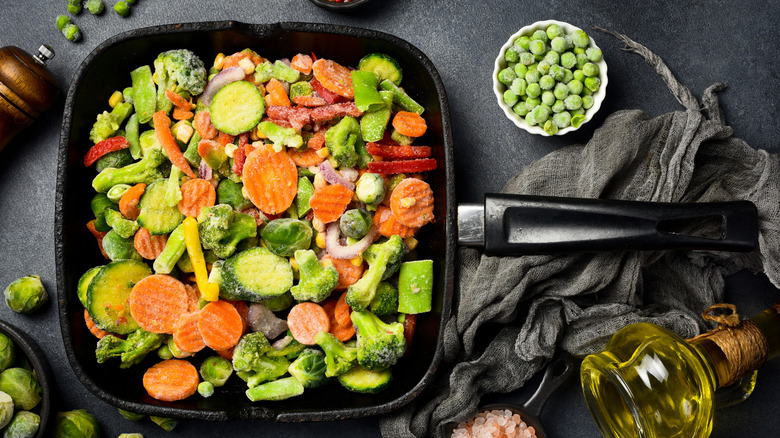 Assorted frozen vegetables in a large square skillet