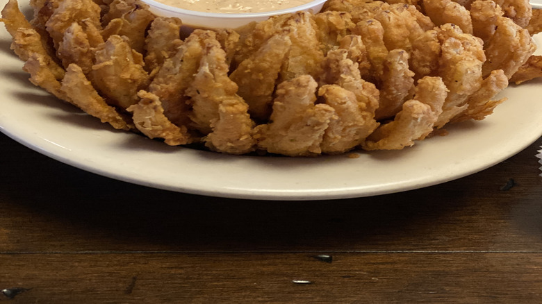 Texas Roadhouse Cactus Blossom appetizer with dipping sauce