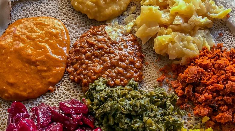 Beyaynetu served on sheet of injera