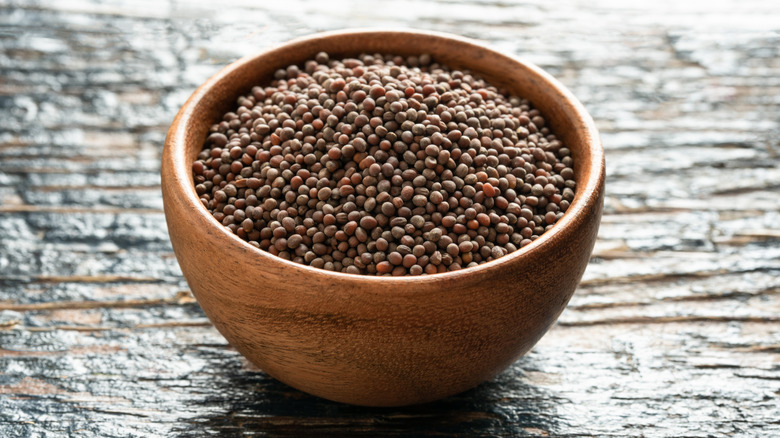 Small bowl of brown mustard seed