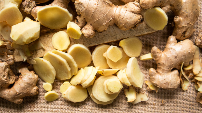 Sliced and whole ginger on a tablecloth