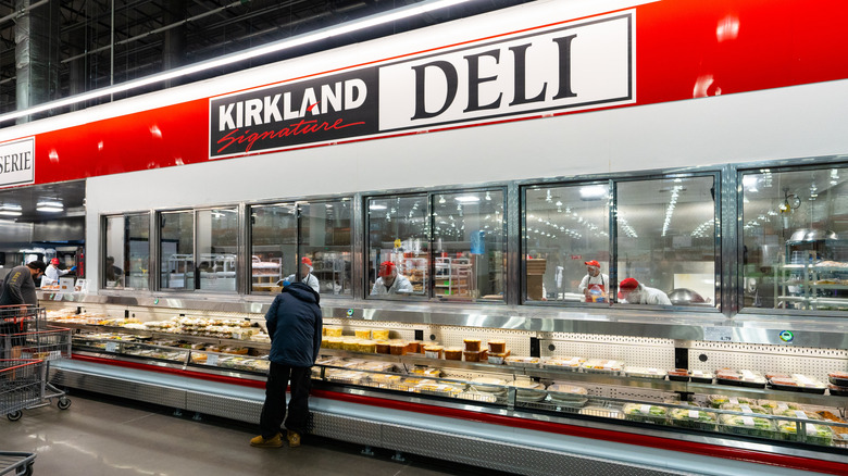 Customer browsing at a Costco deli case
