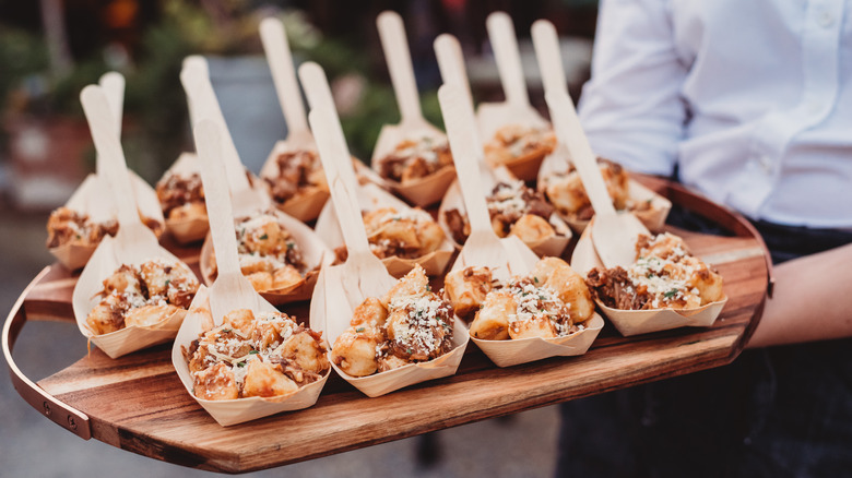 appetizers in bowls with forks