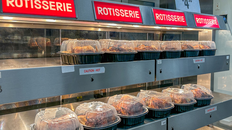 Warming light display stocked with rotisserie chickens