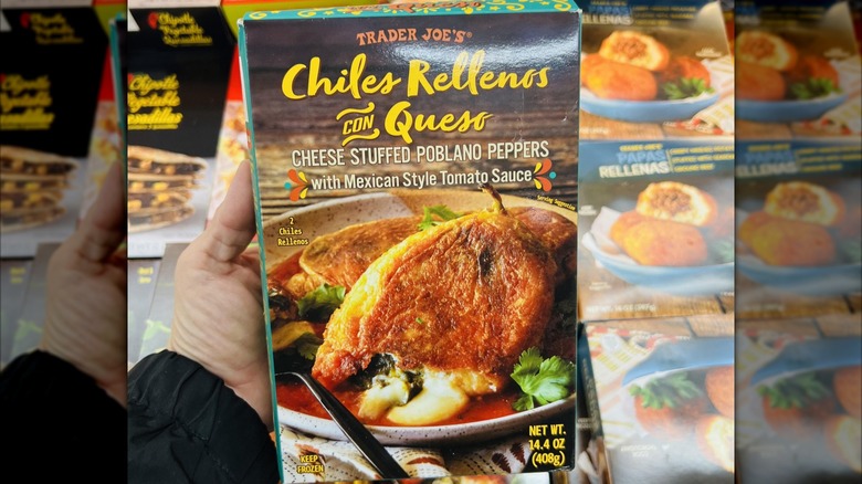 Hand holding box of Trader Joe's Chili Rellenos Con Queso