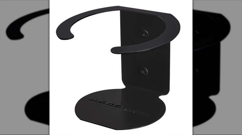 A magnetic cup holder against a white background.