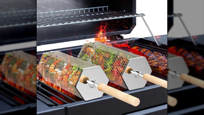 Rolling grill baskets on a gas grill.