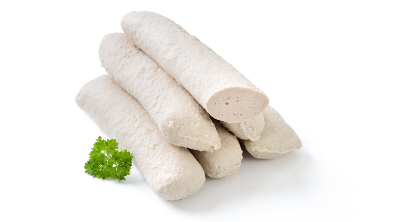 Stack of wollwurst links on a white background