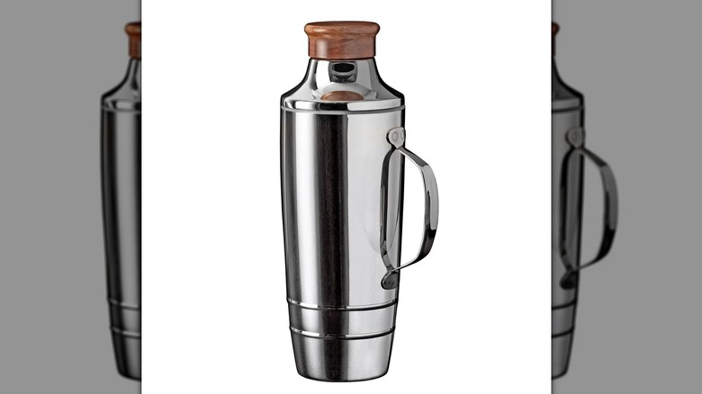 An oversized stainless steel cocktail shaker