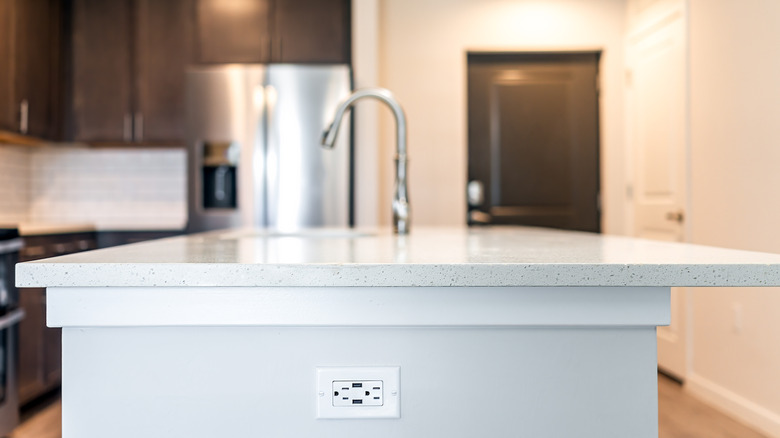 Kitchen island with built-in outlet
