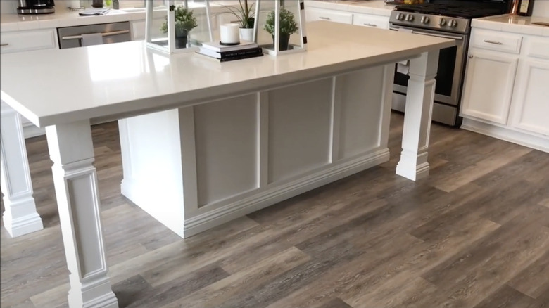 Kitchen island with white furniture-style legs