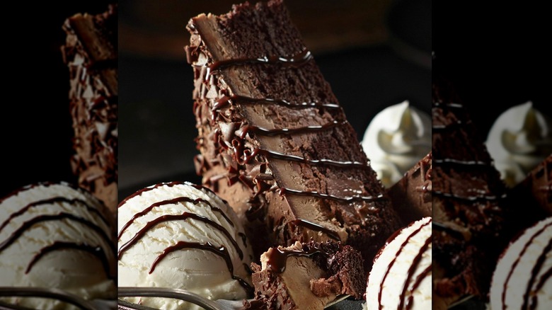Chocolate Stampede Cake with scoops of ice cream and whipped cream