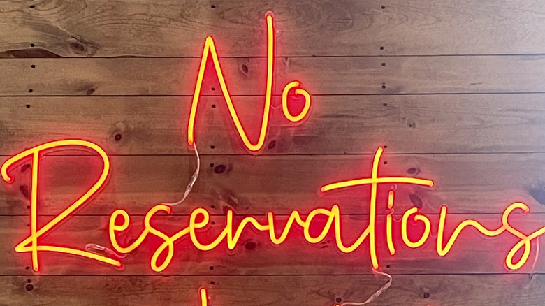 Neon No Reservations sign