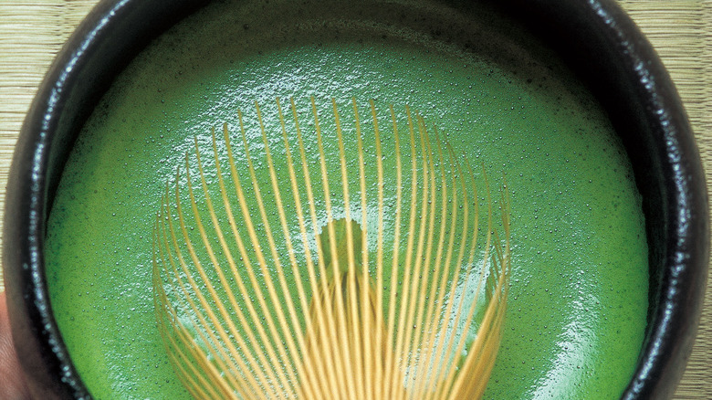 a matcha whisk in bowl of matcha