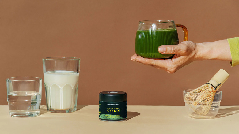 hot matcha, whisk in water, milk, and matcha container