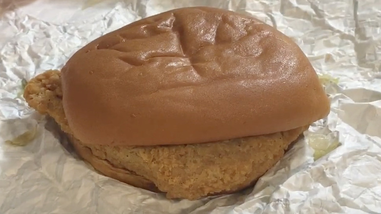KFC Canada plant-based sandwich on white paper
