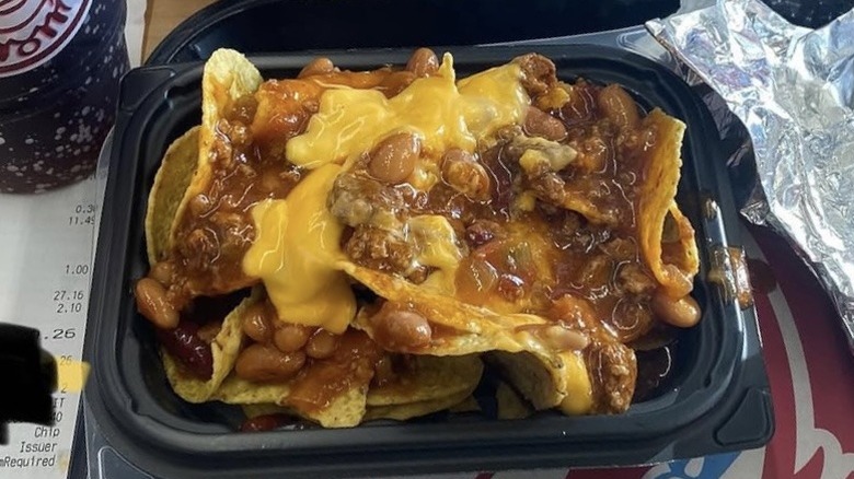 Wendy's chili cheese nachos in a black bowl