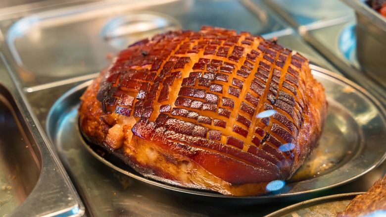 Baked ham with cross-hatch scoring in pan