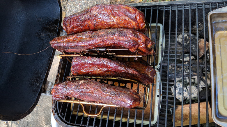 Rib rack on charcoal smoker