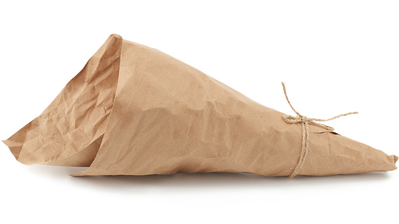 Cone-shaped brown parchment paper on white background
