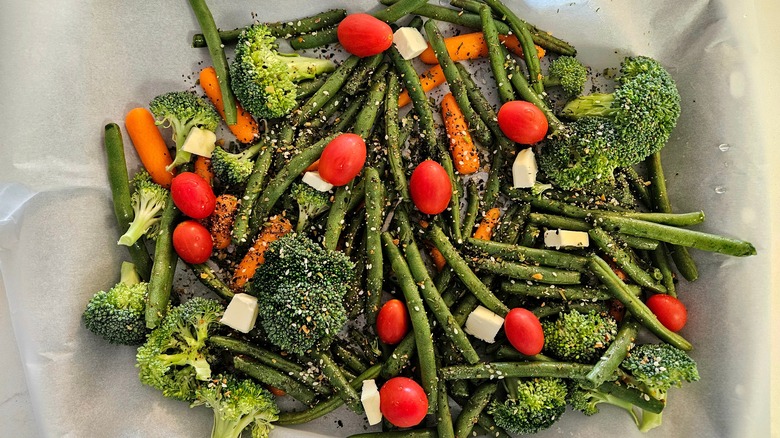 Assorted, seasoned veggies on parchment paper