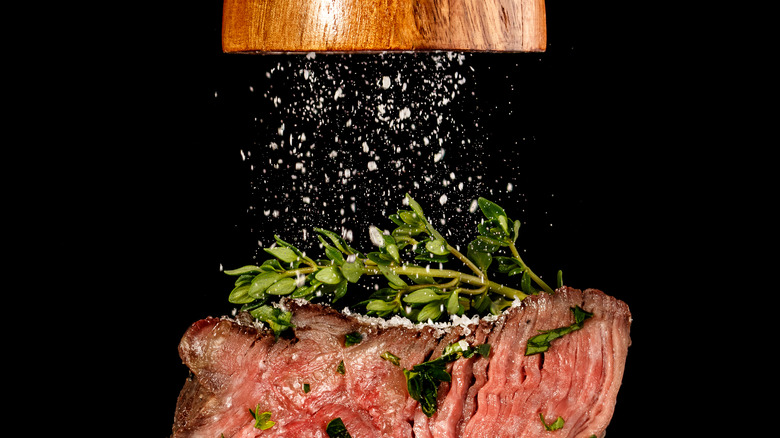 Salt ground onto finished steak