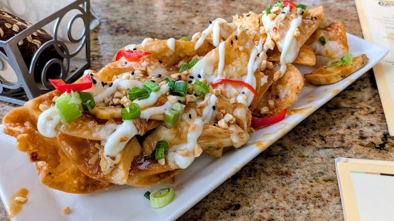Asian chicken nachos from Cheesecake Factory on table