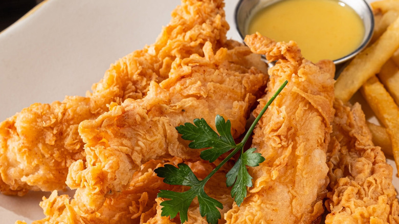 Platter of crispy chicken tenders at TGI Fridays