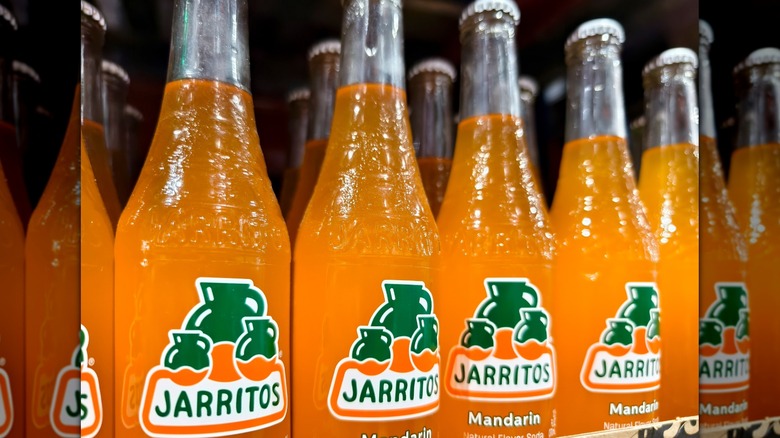 Bottles of Jarritos Mandarin on shelf