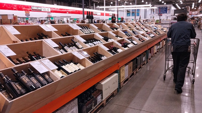 Customer shopping Costco's wine selection