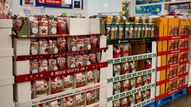 Assorted Costco gift baskets stacked on pallets