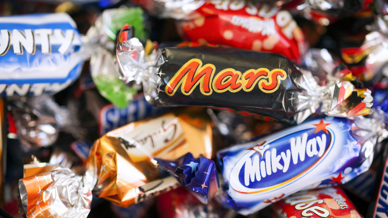 Assorted candies including Mars and Milky Way pieces