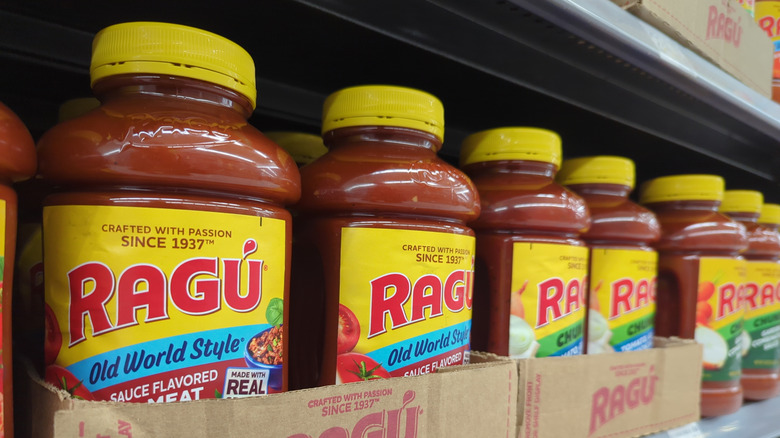 Bottles of Ragú lining a store shelf