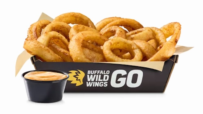 Basket of Onion Rings with a cup of B-Dubs dip from Buffalo Wild Wings.