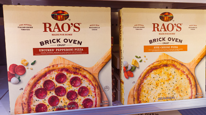 Two Rao's frozen pizzas are displayed in a cold case