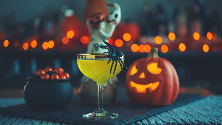 Halloween cocktail with spooky decoration