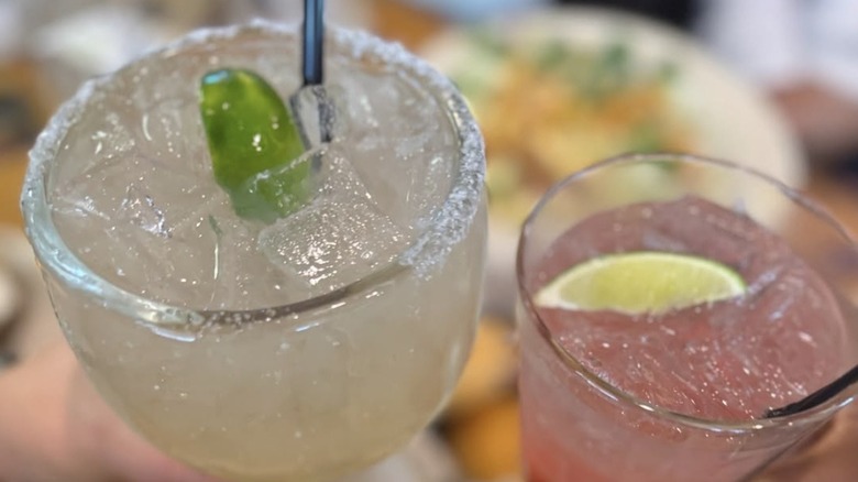 Texas Roadhouse cocktails toasting over a meal