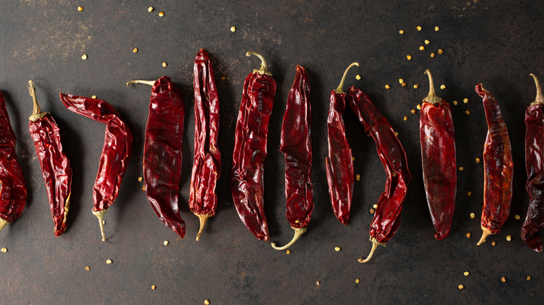 A row of dried Guajillo chile peppers