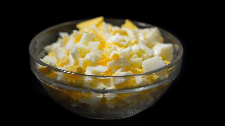 Small glass bowl of diced hard boiled eggs