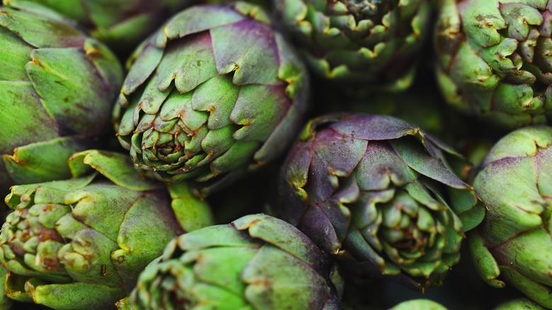 A bunch of artichoke heads