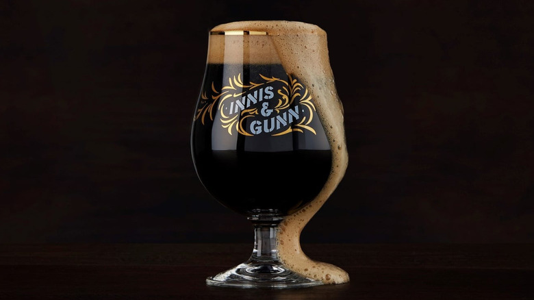 Overflowing glass of Innis & Gunn Irish Whiskey Cask Stout
