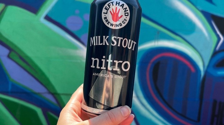 Hand holding can of Left Hand Milk Stout Nitro