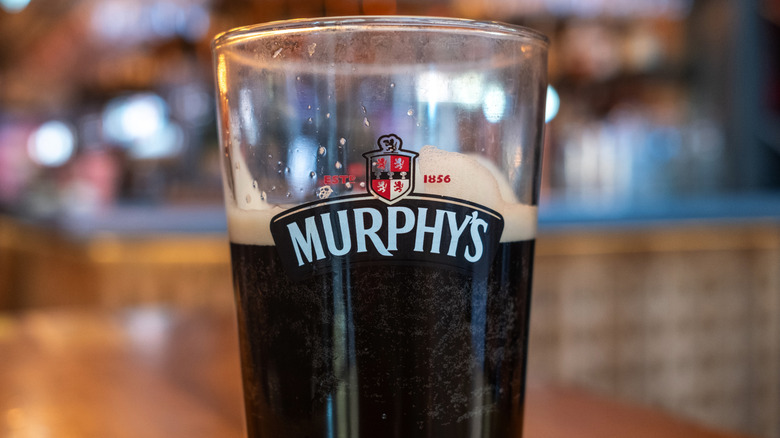 Partially drank pint of Murphy's Stout