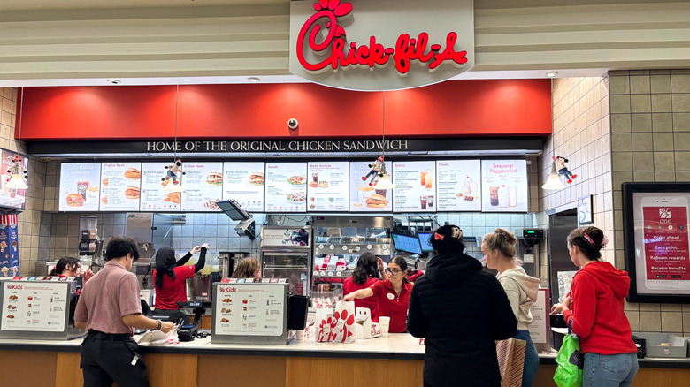 Customers lined up at a Chick-fil-A counter