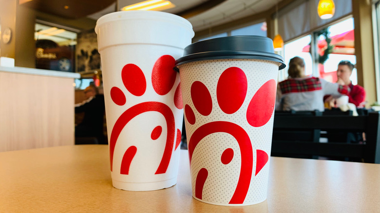Closeup of Chick-fil-A drink cups set on a table in a restaurant