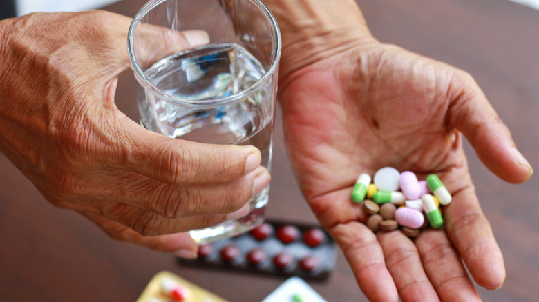 person taking various medication