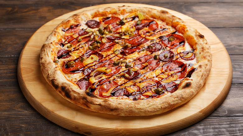 Pepperoni pizza with drizzle of balsamic vinegar