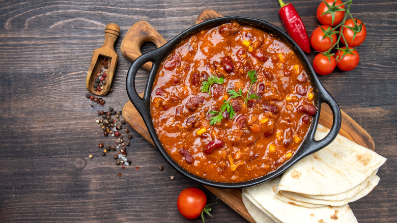 Cast iron pot of chili stew