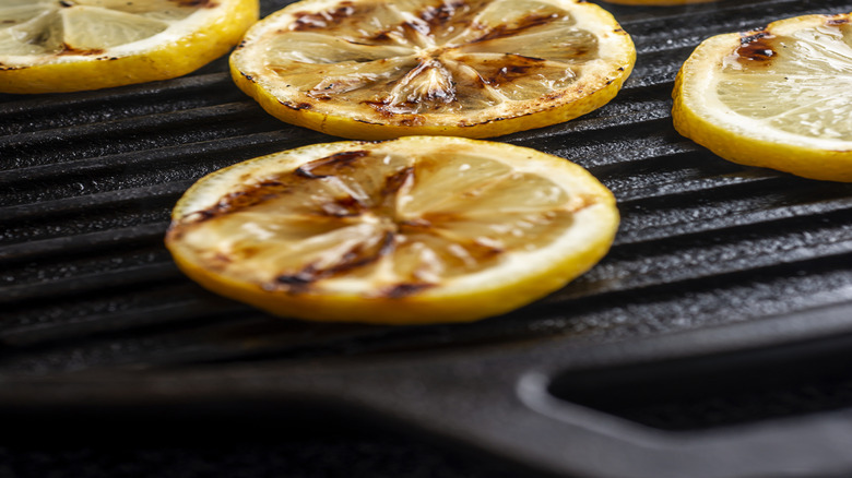 Grilled lemon slices on a cast iron grill pan